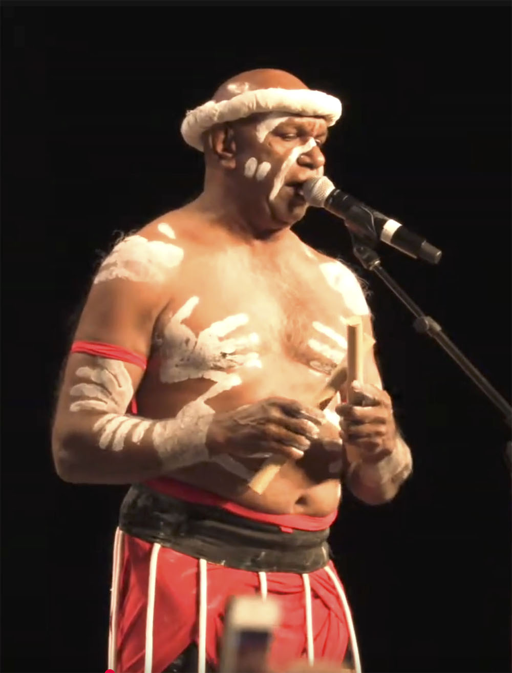 Aboriginal act entertaining guests on a harbour cruise